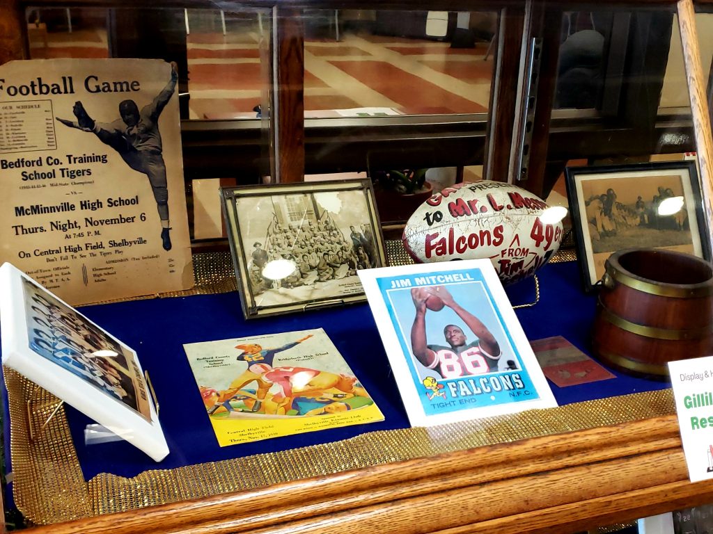 Multiple Historical Materials from the Bedford County Training School, from school programs to a game ball presented to Coach Messengale from Jim Mitchell, a BCTS alum who went on to play for the Atlanta Falcons from 1969-1979.